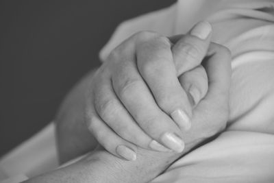 Close-up of hand touching baby feet