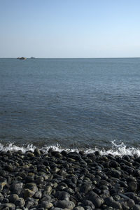 Scenic view of sea against clear sky
