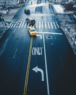 High angle view of cars and signs on city street