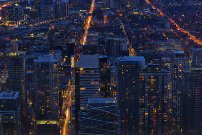 Full frame shot of buildings in city at night