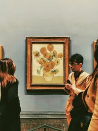 People standing in front of museum