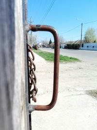 Close-up of metal structure against sky