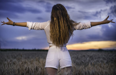 Woman standing on field