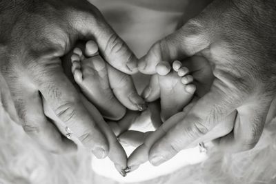 Close-up of hand holding baby