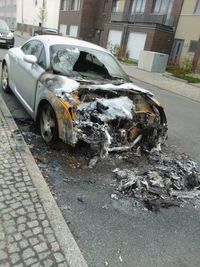 Abandoned car on road