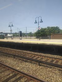 Train on railroad station platform against sky