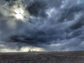 Scenic view of dramatic sky over land