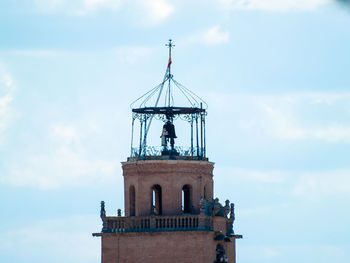 Low angle view of bell tower against sky