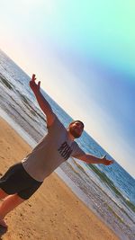 Man on beach against sky