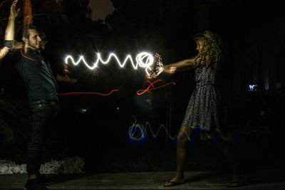 View of illuminated people at night