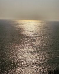 Scenic view of calm sea at sunset