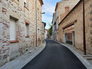 Narrow alley along buildings