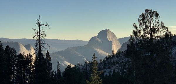 Panoramic view of snowcapped mountains against sky during sunset