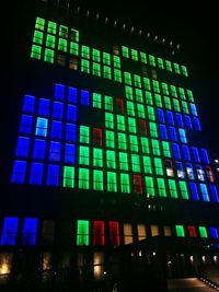 Low angle view of illuminated building at night