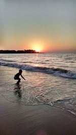 Scenic view of sea at sunset