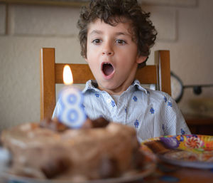 Portrait of cute boy eating food