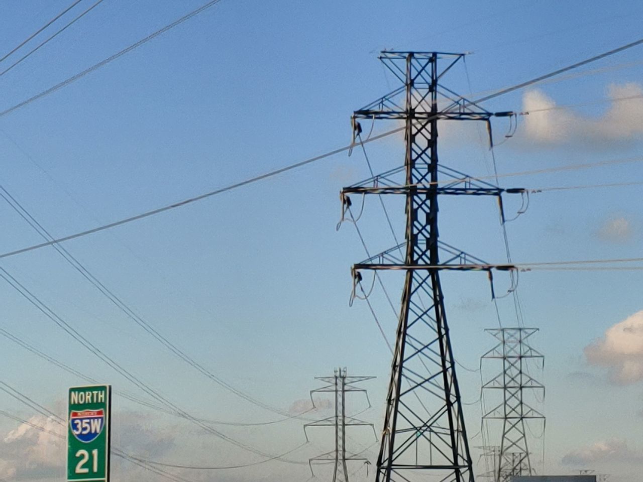 LOW ANGLE VIEW OF POWER LINES AGAINST SKY