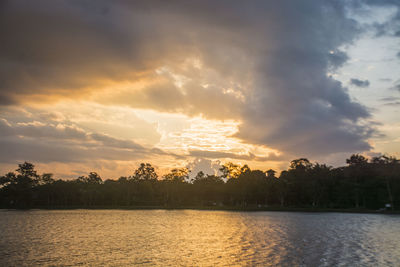 Scenic view of lake against sky during sunset