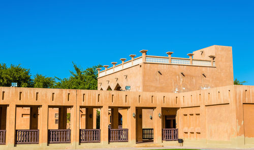 Low angle view of building against blue sky