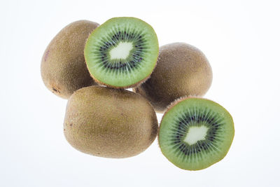 Close-up of fruits over white background