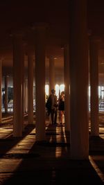 People walking in corridor of building