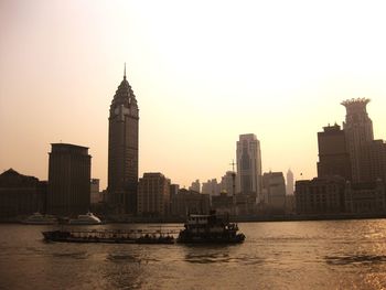 View of skyscrapers in city against clear sky