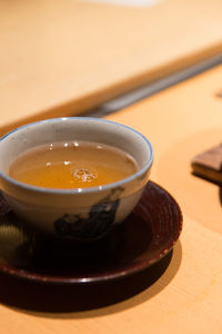 Close-up of tea cup on table