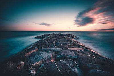 Scenic view of sea against sky during sunset