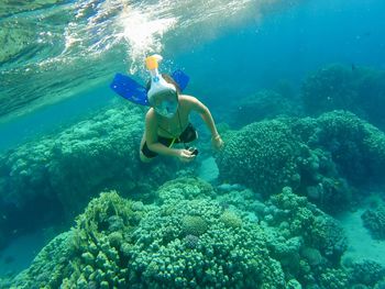 Full length of girl swimming in sea