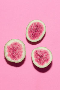 Fresh figs on pink background. vanilla fashion style