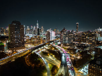 High angle view of illuminated buildings in city at night