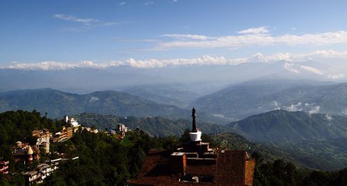 Scenic view of temple on mountain at nagarkot against sky