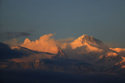 Scenic view of snowcapped mountains against sky