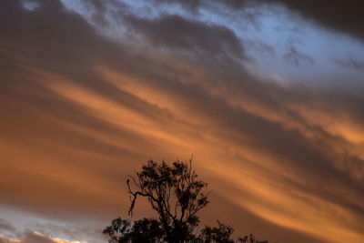 Low angle view of cloudy sky at sunset