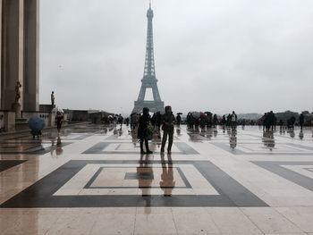 People walking in front of tower