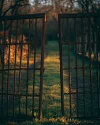 Scenic view of field seen through metal fence