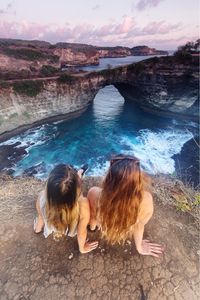 Rear view of women on shore