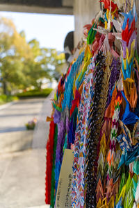 Close-up of multi colored hanging for sale in market