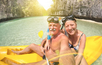 Portrait of smiling senior couple in kayak