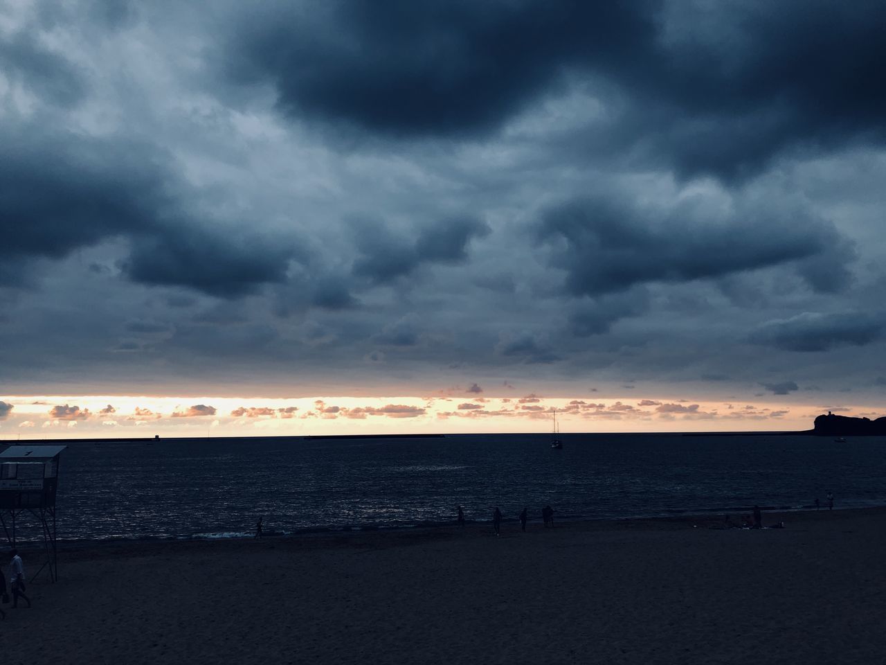 cloud - sky, sky, sea, water, beauty in nature, sunset, scenics - nature, land, beach, horizon, tranquility, tranquil scene, nature, horizon over water, storm, overcast, no people, dramatic sky, outdoors, ominous