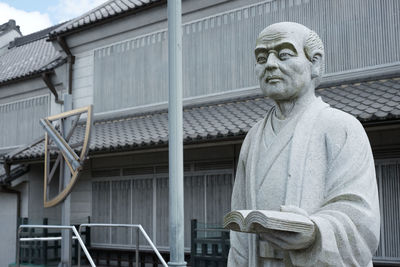 Portrait of man against built structure