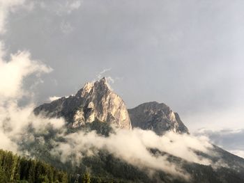 Low angle view of majestic mountains against sky