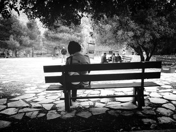 People sitting on bench in park