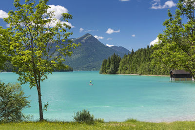 Scenic view of lake against blue sky