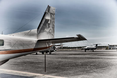 Airplane on runway against sky