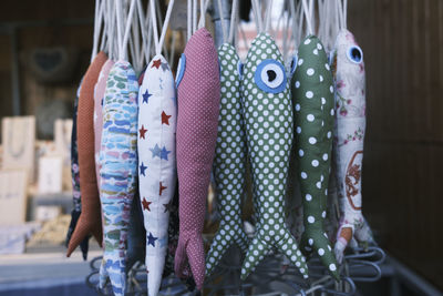 Fabric fishes hanging on a street market