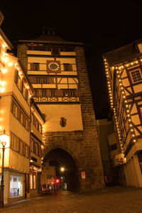 Low angle view of illuminated buildings at night