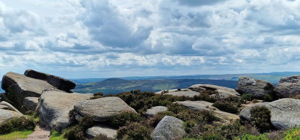 Rocks on beach against sky