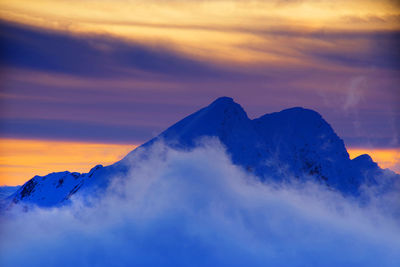 Scenic view of mountains against sky during sunset