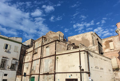 Low angle view of old building against sky